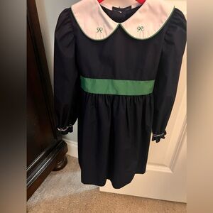 Girls 4T Christmas dress. New. 3 buttons at top of back. Bow ties in back.